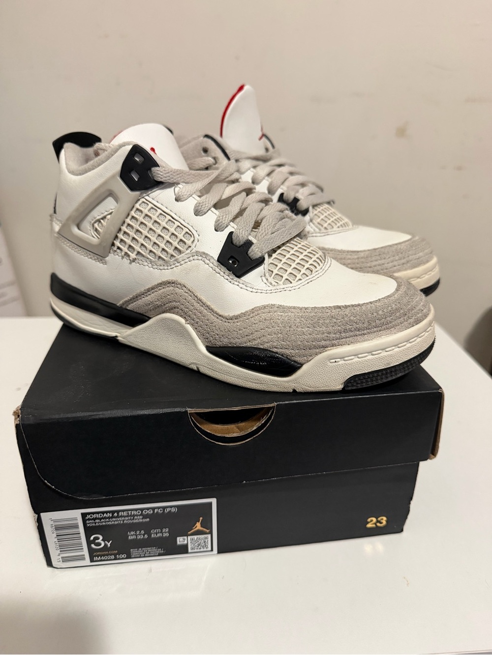 Jordan Air 4 Low-Top in White, Gray and Black with Red Tongue Detail